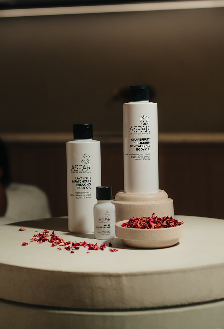 Aspar skincare products on a neutral background