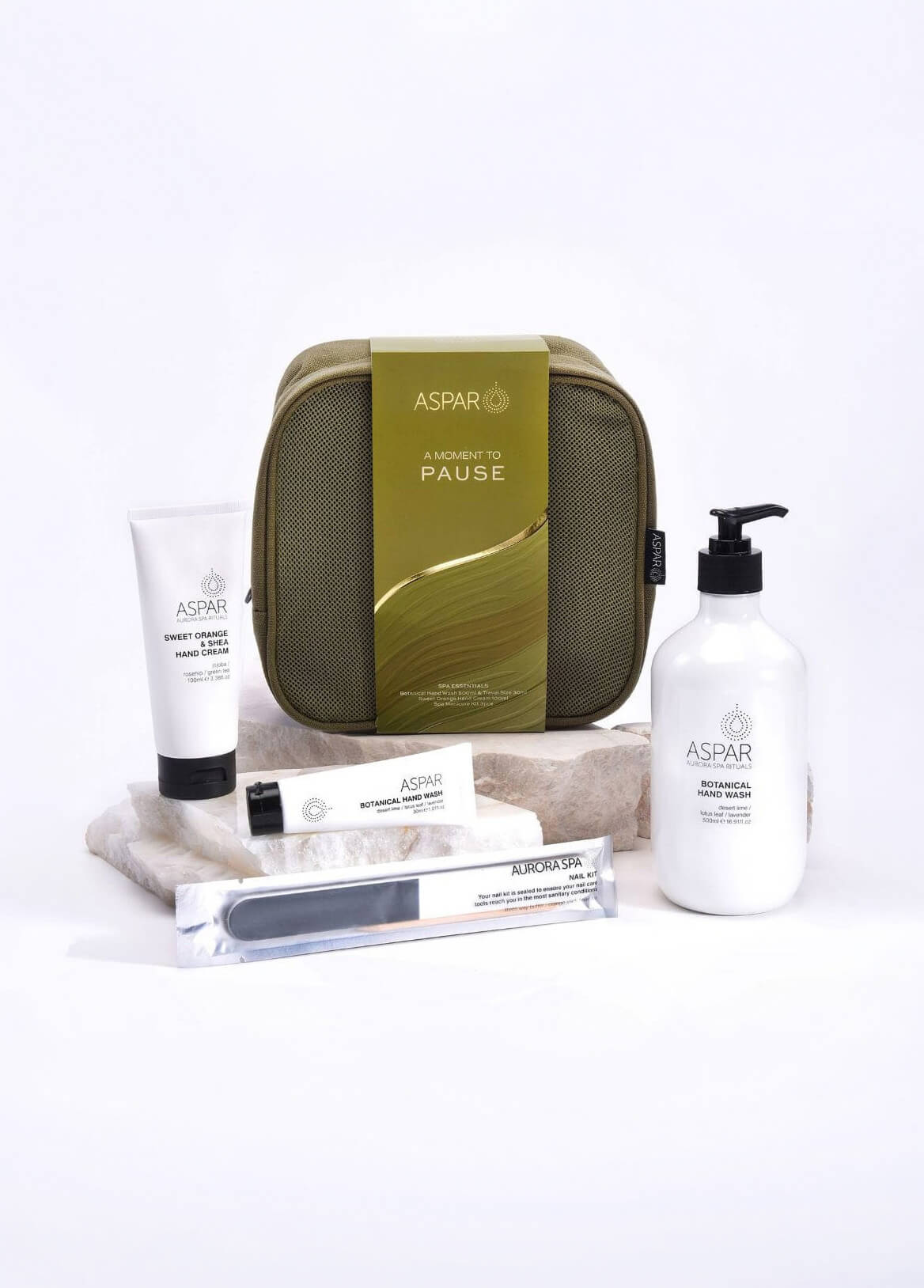 Aspar skincare products including a green travel case, bottles, and tubes on a white background