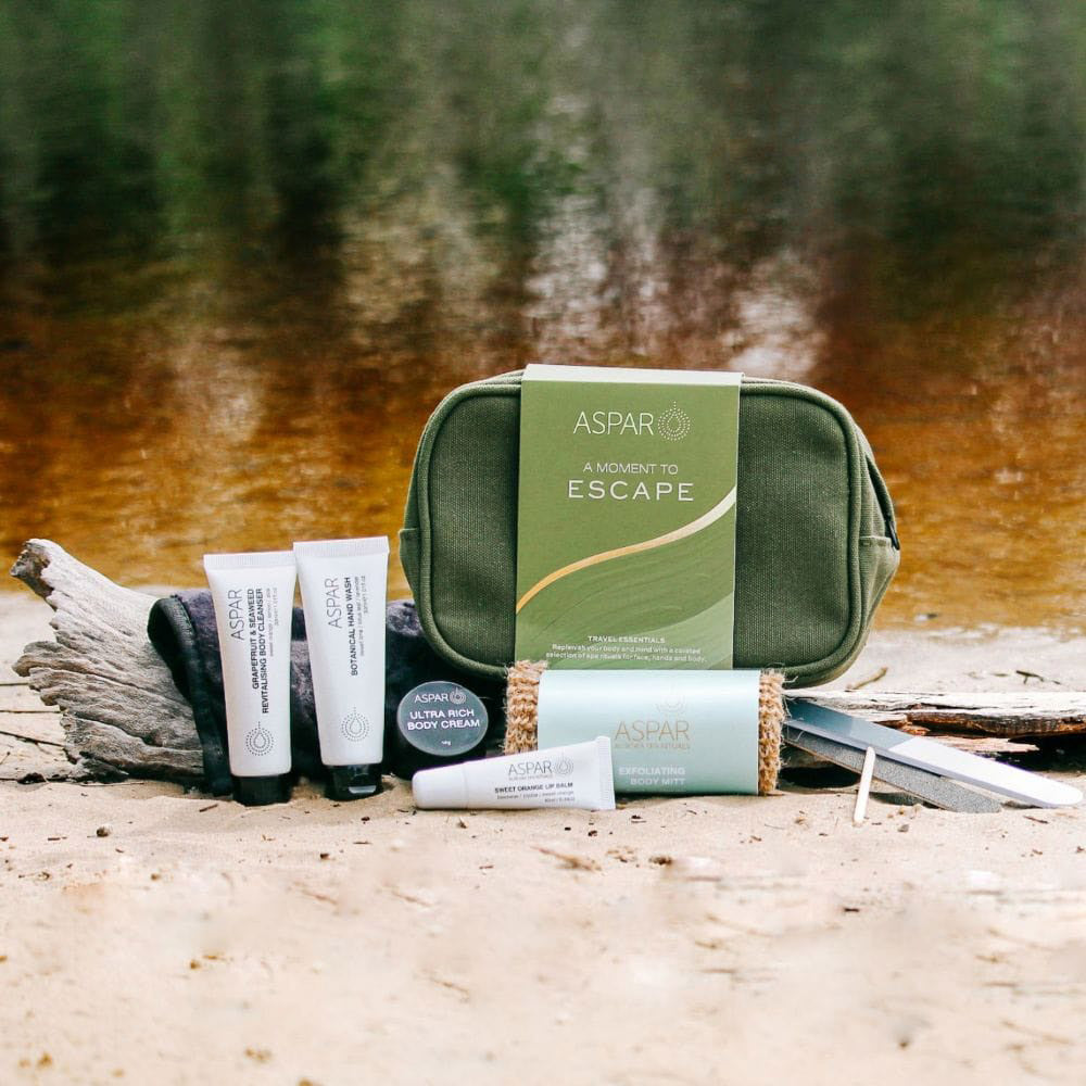 Cosmetic bag with skincare products on a natural background