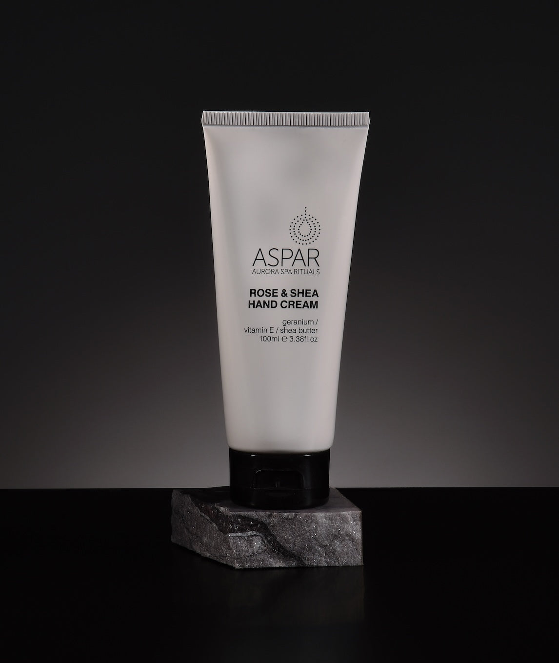 Tube of Aspar Rose & Shea Hand Cream on a dark background