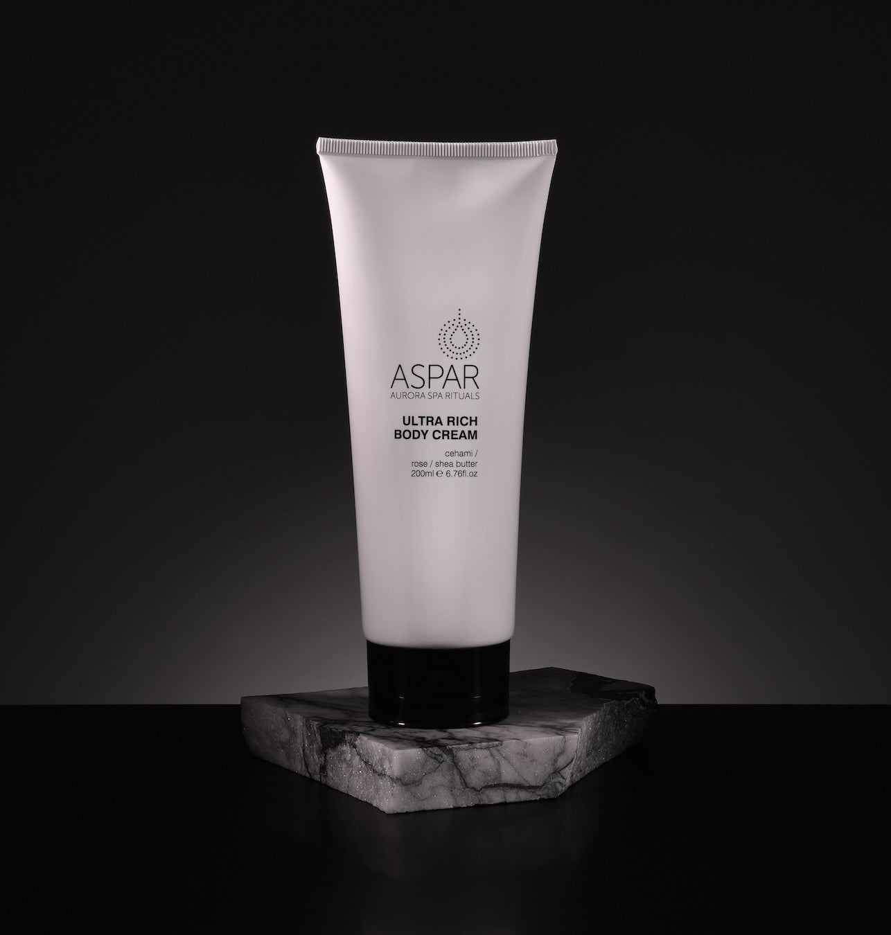 Tube of Aspar Ultra Rich Body Cream on a dark background